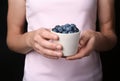 Woman holding crockery with juicy fresh blueberries Royalty Free Stock Photo