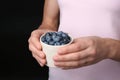 Woman holding crockery with juicy fresh blueberries Royalty Free Stock Photo