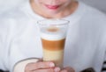 Woman holding cup Coffee latte milk froth the hot drink Royalty Free Stock Photo