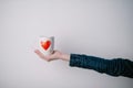 Woman holding cup with heart shape. Close up Royalty Free Stock Photo