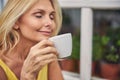 Woman holding a cup of hot beverage Royalty Free Stock Photo