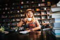 Woman is holding a cup of hot cappuccino and reading a book, Business woman read a book Royalty Free Stock Photo