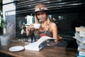 Woman is holding a cup of hot cappuccino and reading a book, Business woman read a book Royalty Free Stock Photo