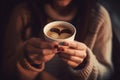 Woman holding cup of hot coffee with heart shape on the surface, neural network generated image Royalty Free Stock Photo