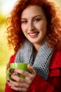 Woman holding cup of tea in park Royalty Free Stock Photo