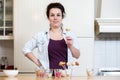 Woman Holding Cupcake Pop In Kitchen Royalty Free Stock Photo