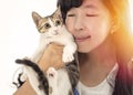 Woman holding with cute cat resting at home Royalty Free Stock Photo