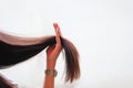 Woman holding at damaged splitting ends of hair, Haircare concept Royalty Free Stock Photo