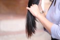 Woman holding at damaged splitting ends of hair, Haircare concept Royalty Free Stock Photo