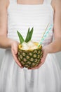 Woman holding delicious pineapple cocktail with ice Royalty Free Stock Photo