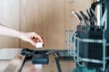 Woman holding detergent capsule under dishwasher compartment Royalty Free Stock Photo