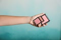 Woman holding different blushers on color background Royalty Free Stock Photo