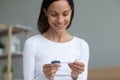 Woman holding digital pregnancy test closeup focus on arms Royalty Free Stock Photo