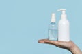 woman holding disinfectant bottles. High quality photo