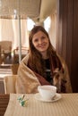 Woman holding a dog in the cafe Royalty Free Stock Photo