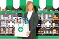 Woman holding drugstore bag in front of pharmacy