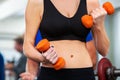 Woman holding dumbbell workout at gym. Royalty Free Stock Photo