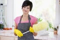 Woman Holding Duster And Wearing Rubber Gloves Royalty Free Stock Photo
