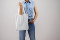 woman holding eco fabric bag isolate on gray Royalty Free Stock Photo