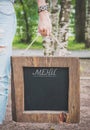 Woman holding empty blackboard with wooden frame. Template Mock Royalty Free Stock Photo