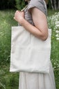 Woman holding empty linen bag. Template mock up Royalty Free Stock Photo