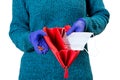 Woman holding empty red wallet and some coins in her hands. Safety mask instead of money Royalty Free Stock Photo