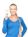 Woman holding energy saving bulb