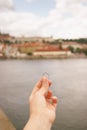 Woman holding an engagement ring front The Charles Bridge. An offer of marriage in Prague, Czech Republic. Royalty Free Stock Photo