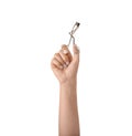 Woman holding eyelash curler on white background Royalty Free Stock Photo