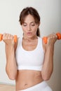 Woman holding fitenss weights Royalty Free Stock Photo