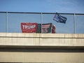 A colorful homemade sign on a freeway overpass in opposition to Donald Trump in the 2020 election.