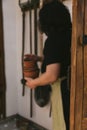 A woman holding flower pots. Figure in blur, selective focus. The woman is unrecognizable. Housewife about to plant flowers. Royalty Free Stock Photo