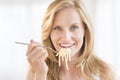 Woman Holding Fork With Pasta At Home Royalty Free Stock Photo