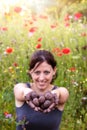 Woman is holding fresh produced seed balls or seed bombs