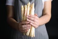 Woman holding fresh white asparagus on black background, closeup Royalty Free Stock Photo