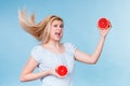 Woman holding fruit red grapefruit half