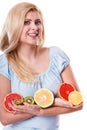 Woman holding fruits kiwi. orange, lemon and grapefruit Royalty Free Stock Photo