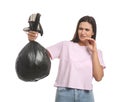 Woman holding full garbage bag on white background Royalty Free Stock Photo