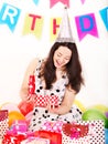 Woman holding gift box at birthday party. Royalty Free Stock Photo