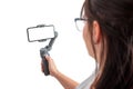 Woman holding gimbal with smart phone