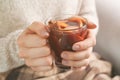 Woman holding glass cup of delicious Christmas wine in hands, closeup Royalty Free Stock Photo