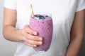 Woman holding glass of delicious blueberry smoothie Royalty Free Stock Photo