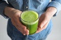 Woman holding glass with delicious detox juice