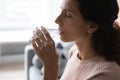 Woman holding glass drinking water, close up side view face Royalty Free Stock Photo