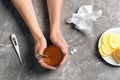 Woman holding glass with hot tea for cold on table Royalty Free Stock Photo