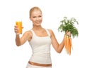 Woman holding glass of juice and carrots Royalty Free Stock Photo