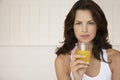 Woman Holding Glass Of Orange Juice Royalty Free Stock Photo