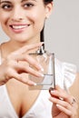 Woman holding glass perfume bottle Royalty Free Stock Photo