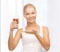 Woman holding glass of tomato juice Royalty Free Stock Photo
