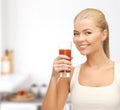 Woman holding glass of tomato juice Royalty Free Stock Photo